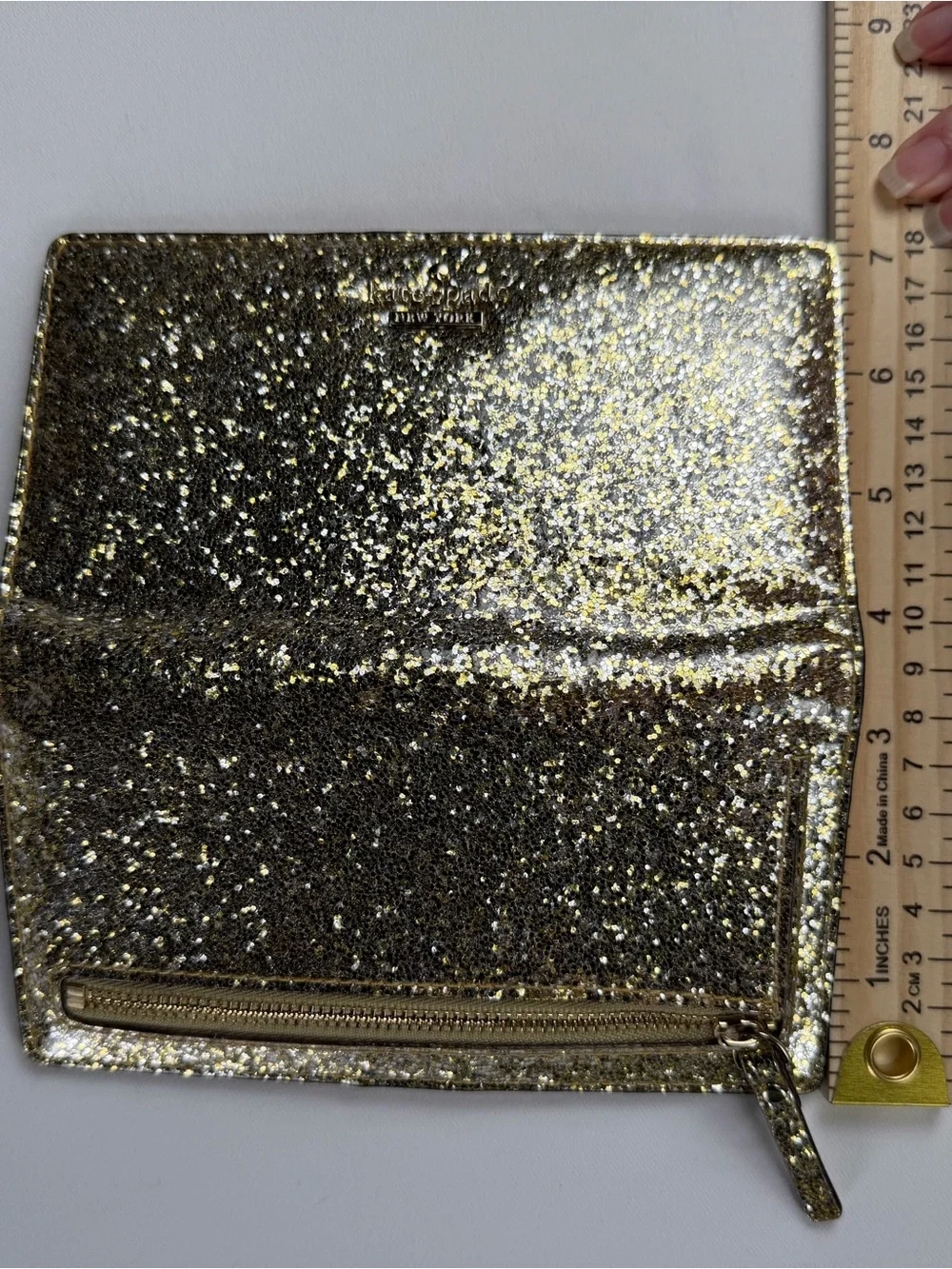 kate spade Gold Glitter Folio wallet with magnetic closure - fun and flirty